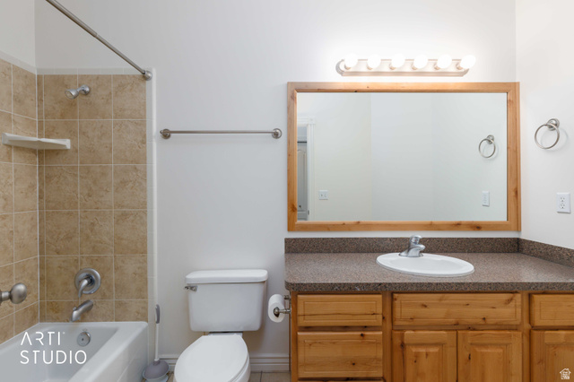 2327 Bluff Ridge Drive Syracuse, UT 84075 - Photo 19 of 66 Bathroom featuring a single vanity with wood cabinetry, a built-in sink, and a speckled countertop
