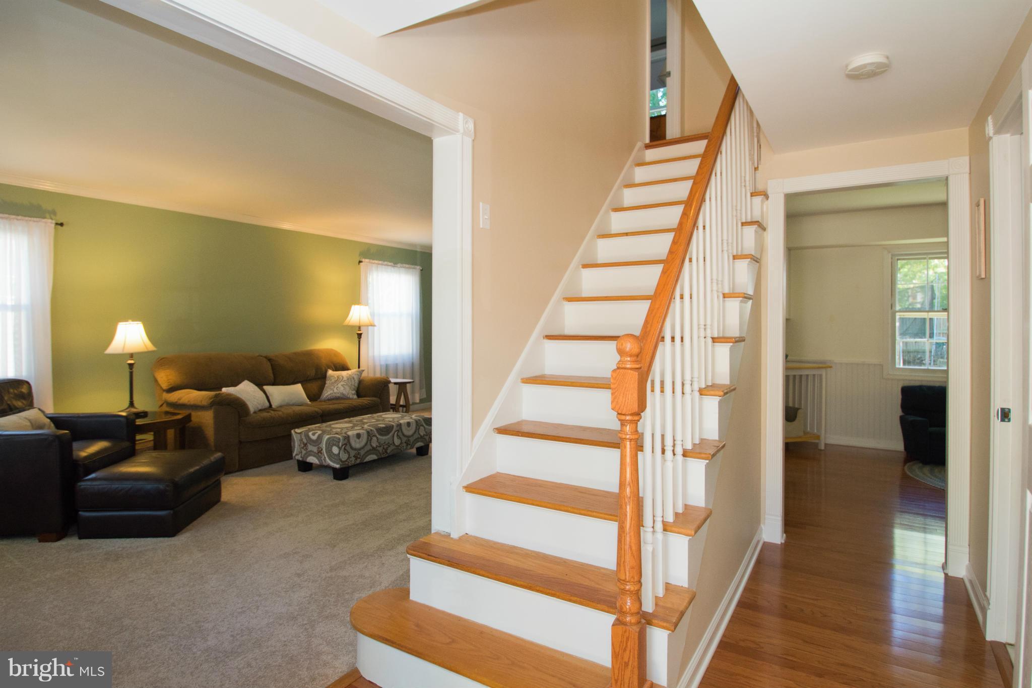 1712 Tarleton Way Crofton, MD 21114 - Photo 2 of 26 a view of a livingroom with furniture and stairs