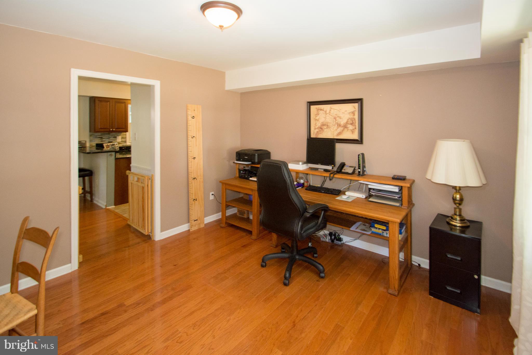 1712 Tarleton Way Crofton, MD 21114 - Photo 11 of 26 a view of a workspace with furniture and a window