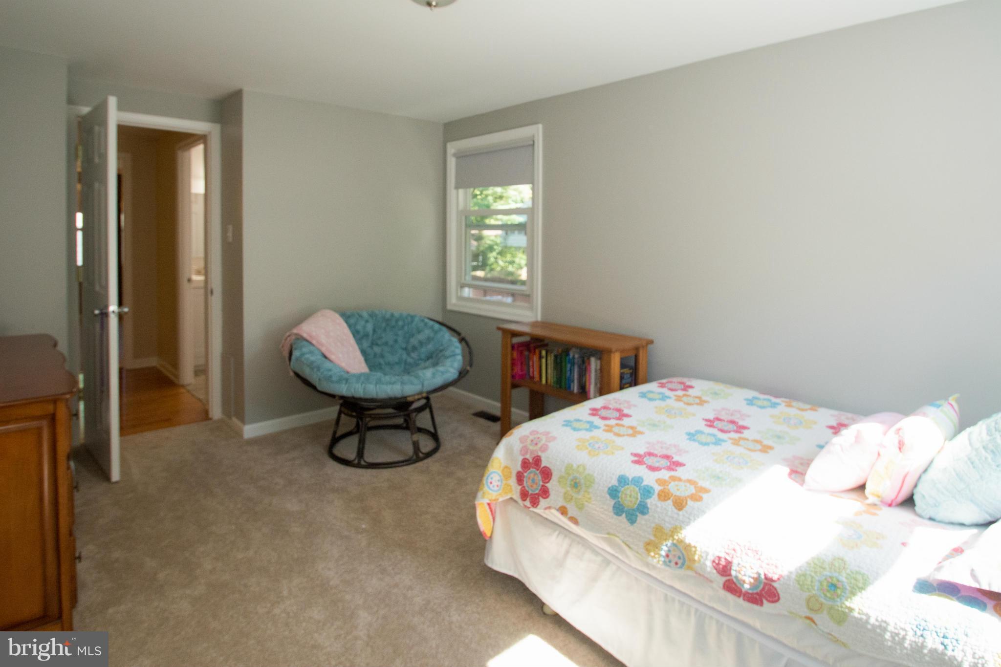 1712 Tarleton Way Crofton, MD 21114 - Photo 15 of 26 a bedroom with a bed a table and chair