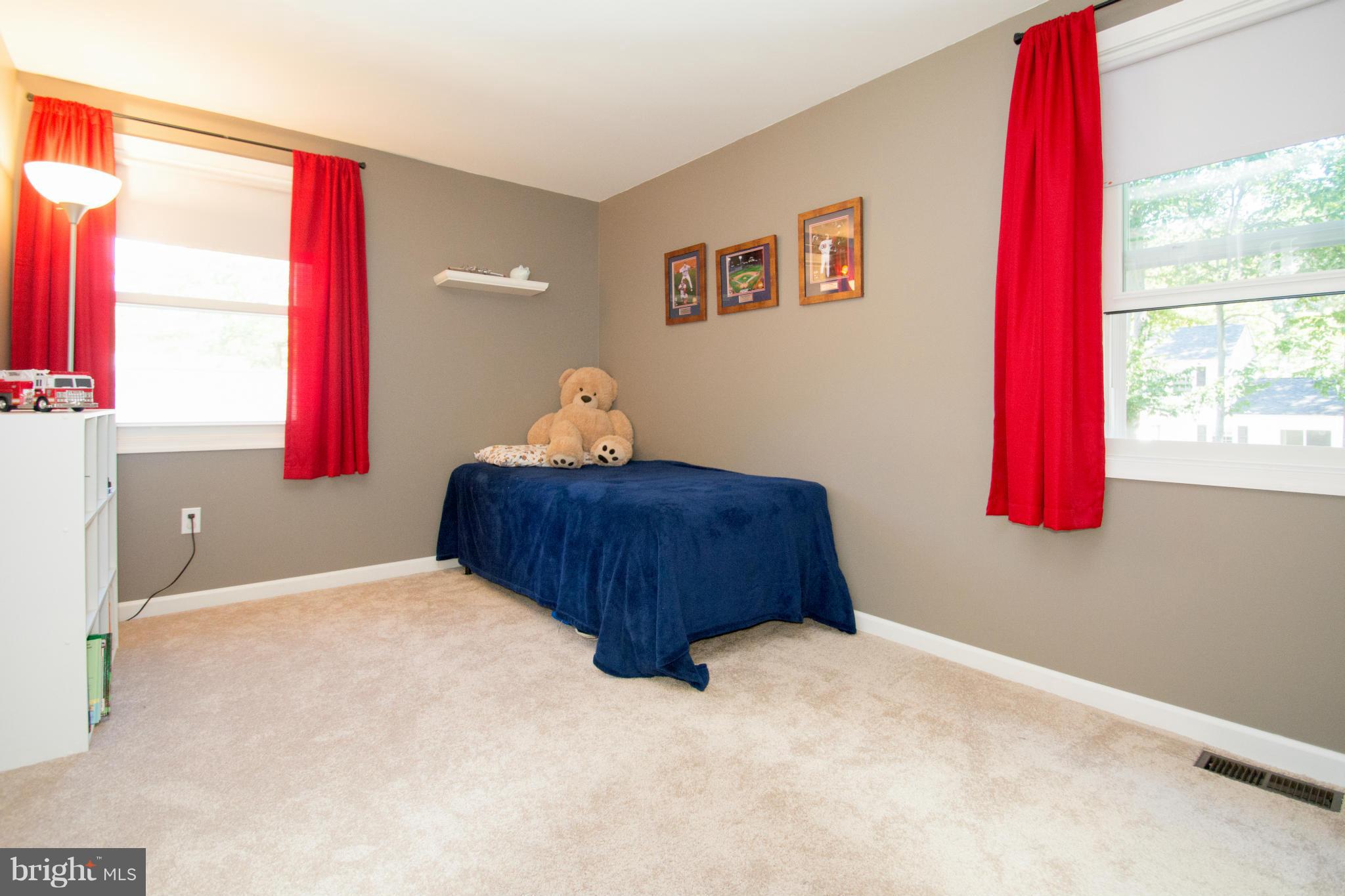 1712 Tarleton Way Crofton, MD 21114 - Photo 16 of 26 a bedroom with a bed and a window