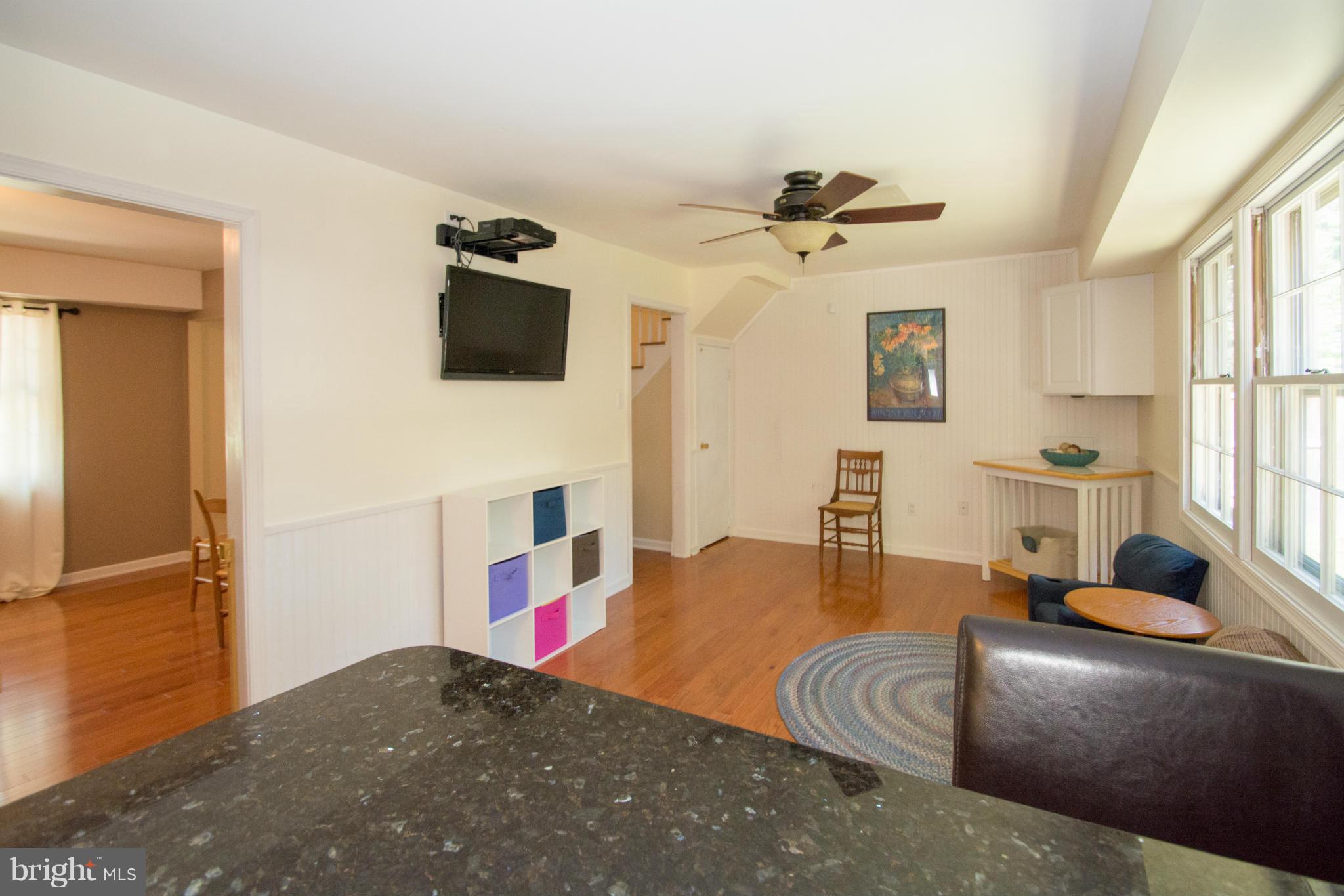 1712 Tarleton Way Crofton, MD 21114 - Photo 9 of 26 a living room with furniture and a flat screen tv