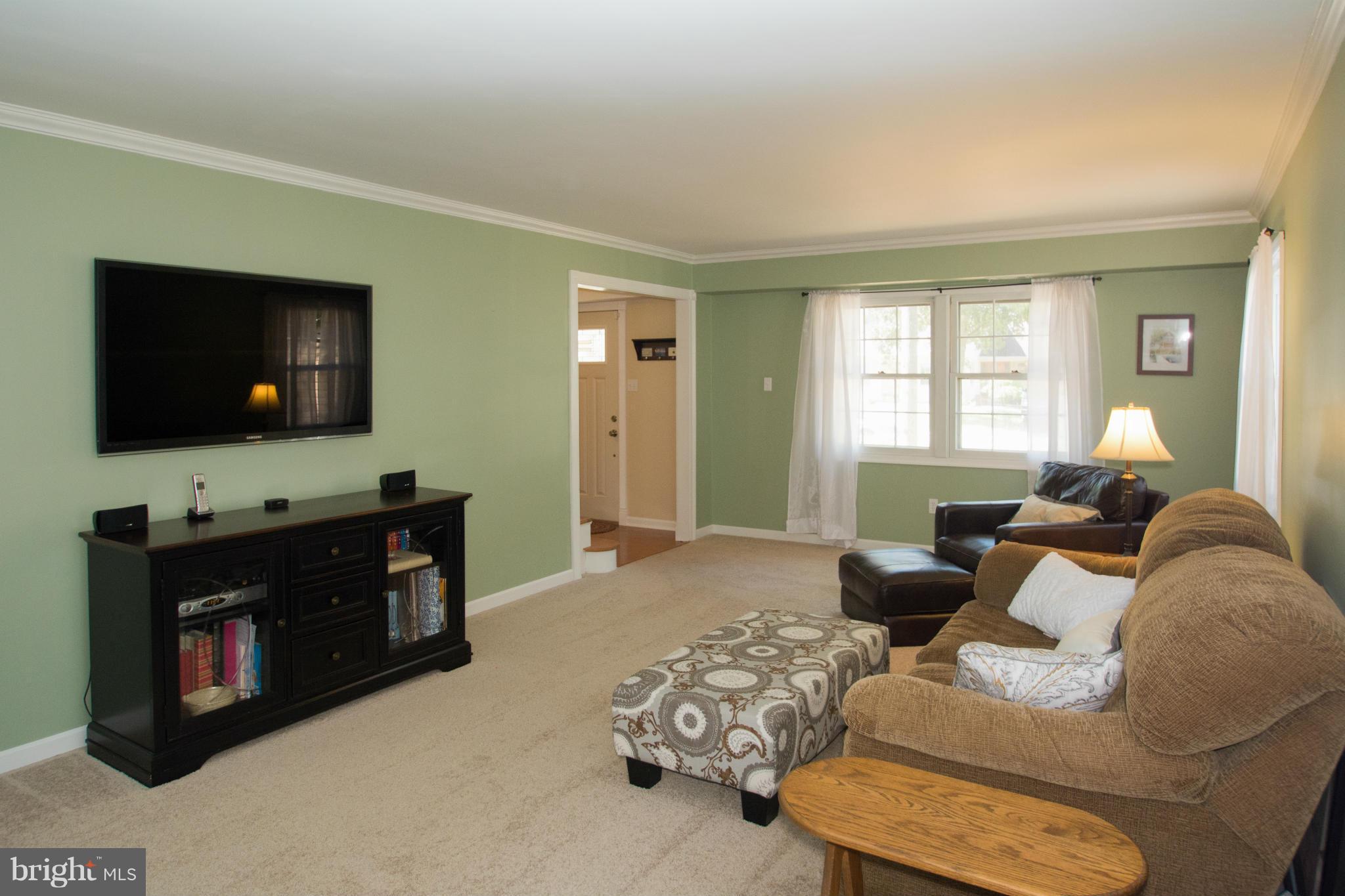 1712 Tarleton Way Crofton, MD 21114 - Photo 10 of 26 a living room with furniture and a flat screen tv