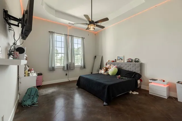 a bedroom with furniture and a window