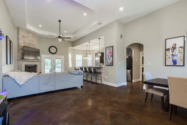 a living room with furniture and a chandelier
