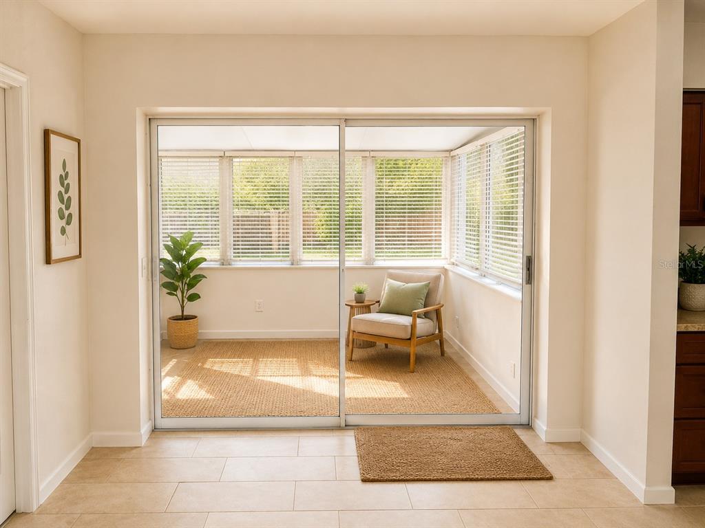 1559 Barry Road Clearwater, FL 33756 - Photo 7 of 20 a living room with furniture and a potted plant