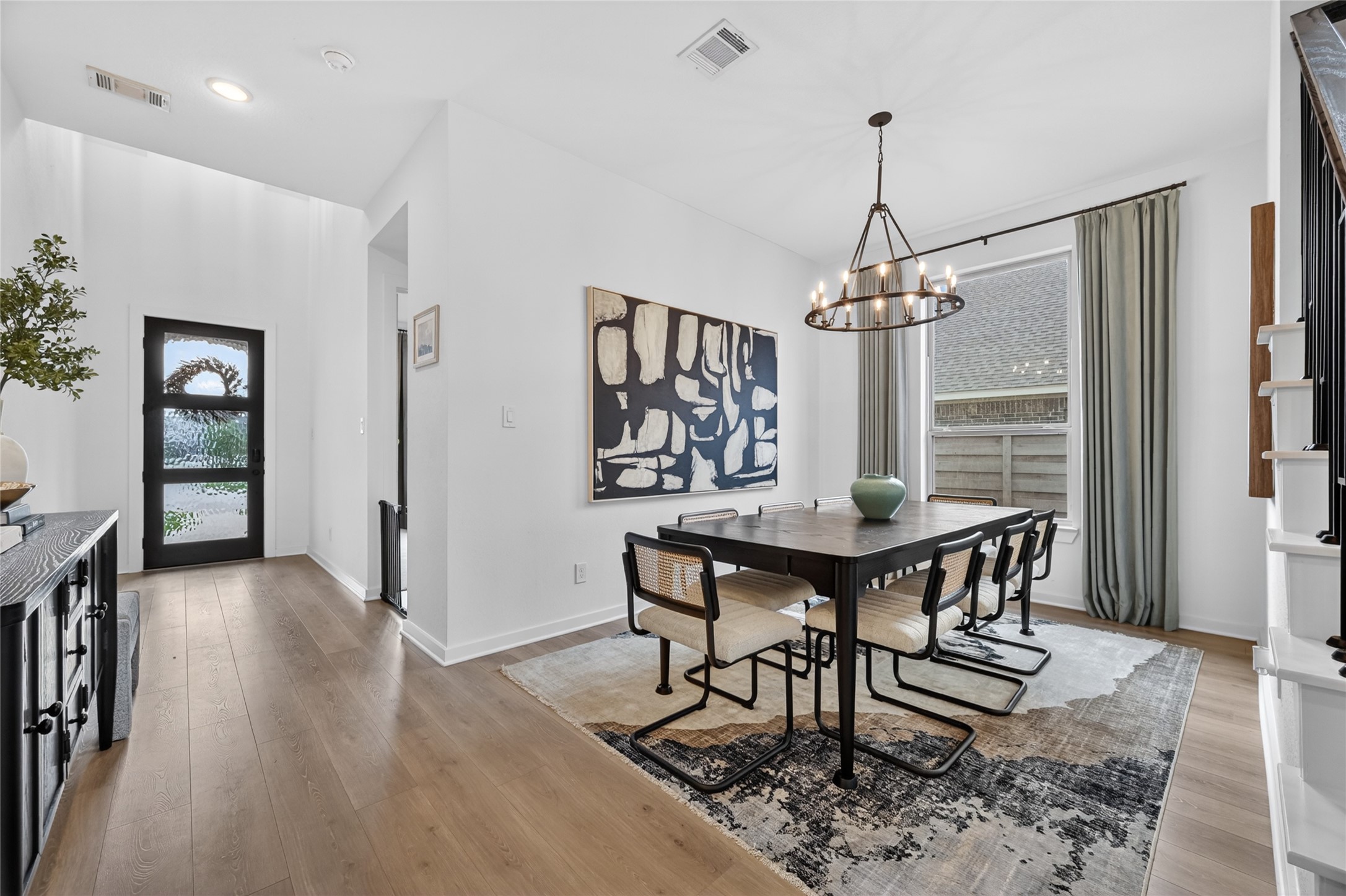 4439 Stone Ridge Lane Manvel, TX 77578 - Photo 5 of 48 a view of a dining room with furniture and wooden floor