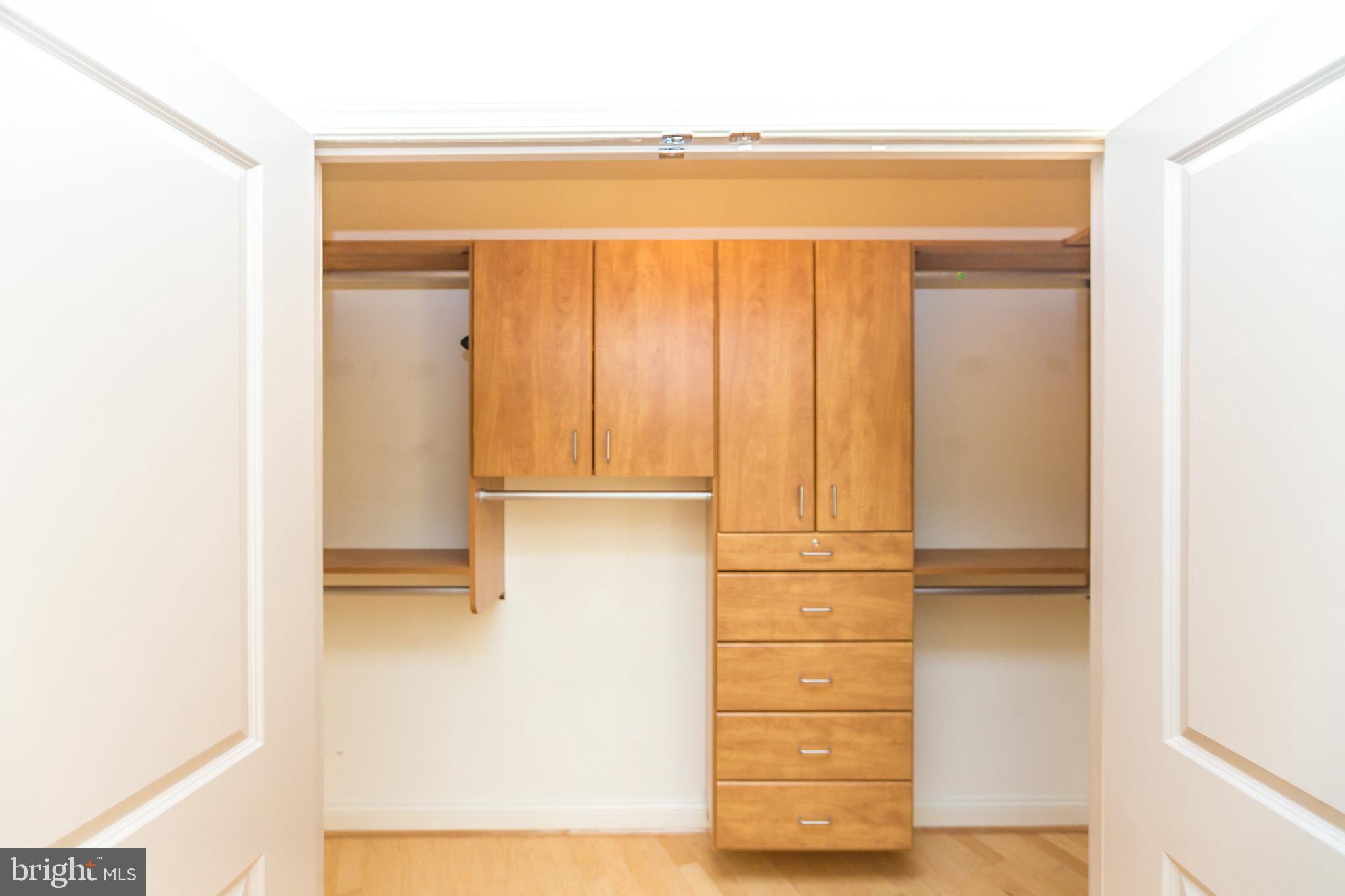 717 President Street, Unit 401 Baltimore, MD 21202 - Photo 22 of 36 a view of walk in closet with empty racks