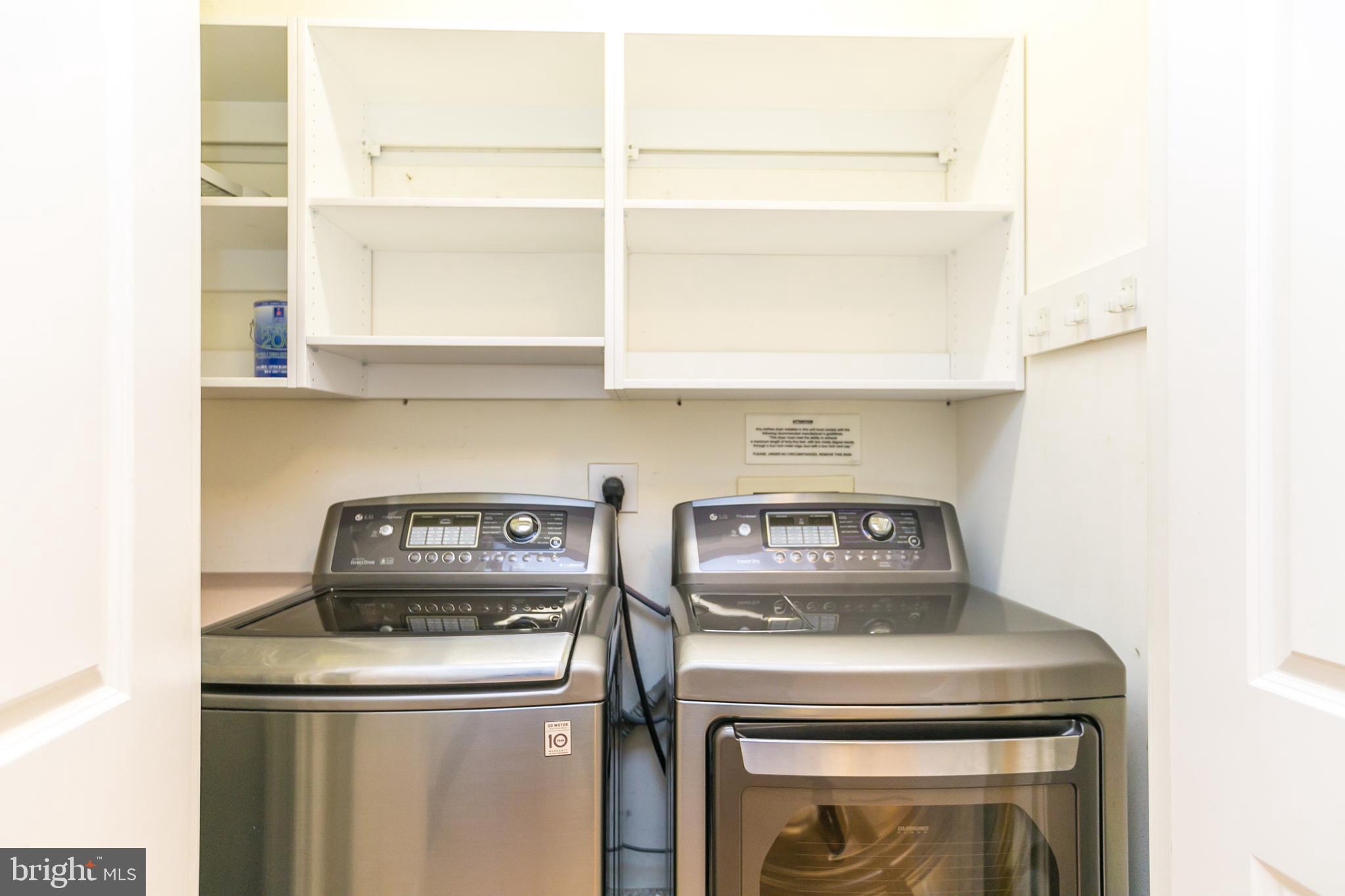 717 President Street, Unit 401 Baltimore, MD 21202 - Photo 29 of 36 a kitchen with a stove and a microwave