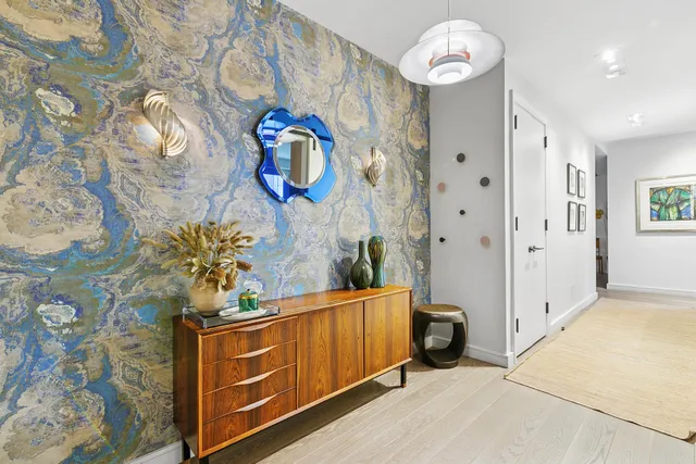 a view of a terrace with chairs and potted plants