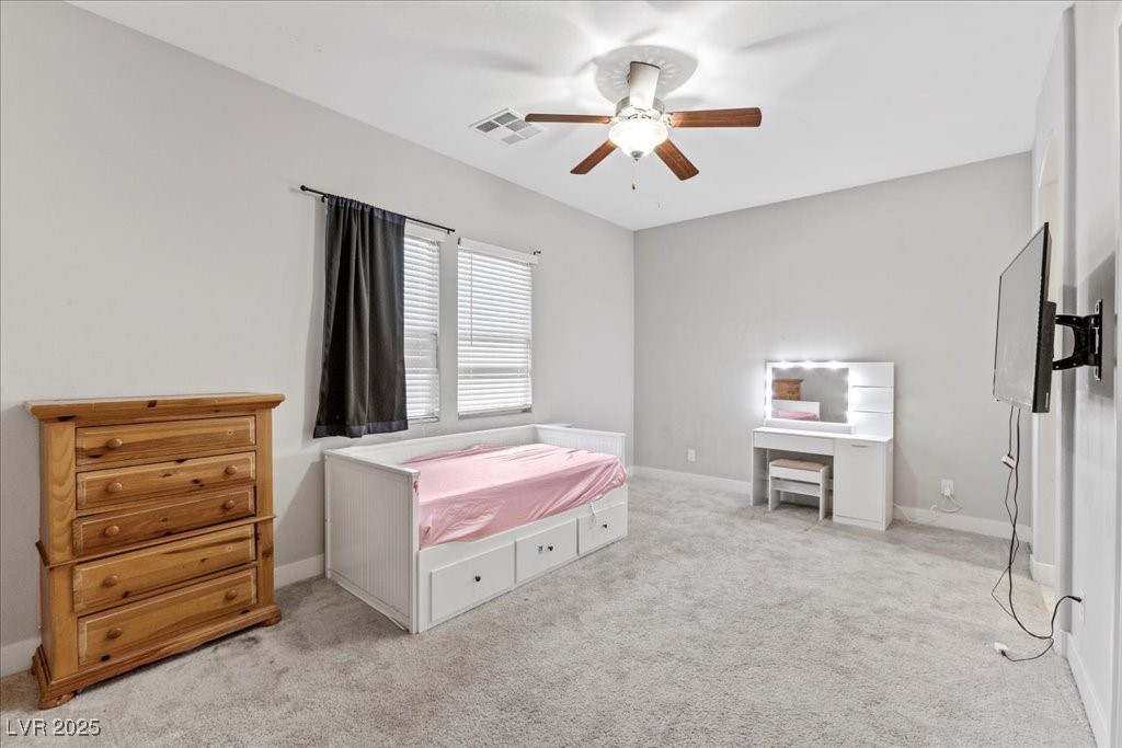 259 Milan Street Henderson, NV 89015 - Photo 39 of 99 Bedroom with light carpet and ceiling fan