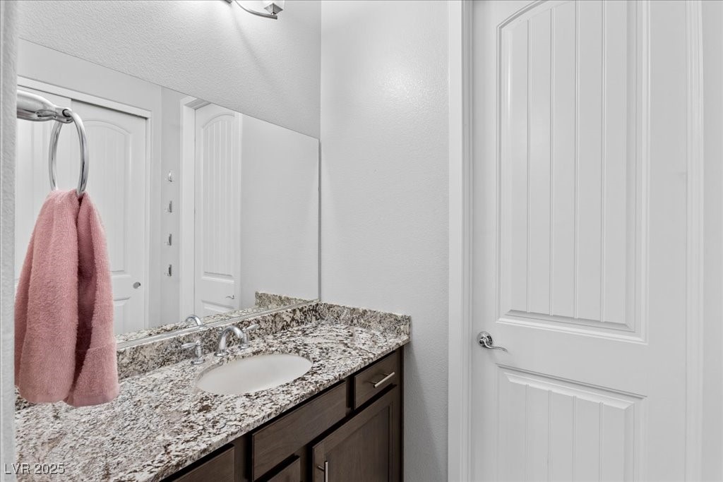 259 Milan Street Henderson, NV 89015 - Photo 49 of 99 Bathroom with vanity and a textured wall