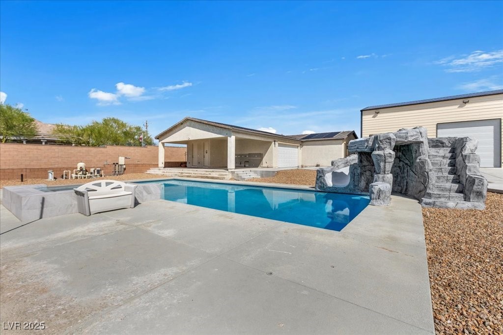 259 Milan Street Henderson, NV 89015 - Photo 83 of 99 View of pool featuring a patio area, a fenced backyard, and a hot tub