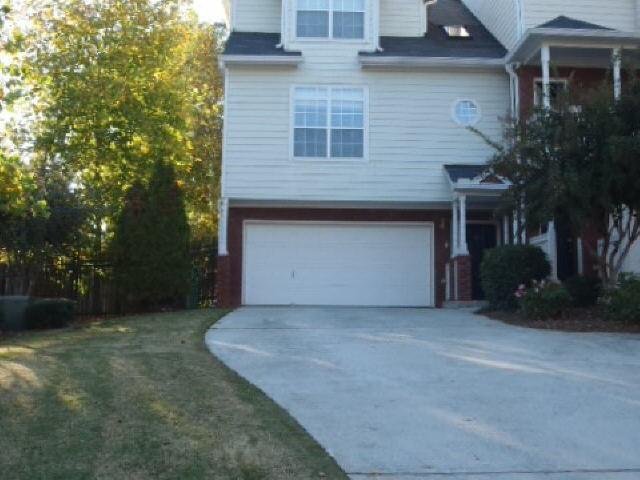 599 Cooper Street Southwest Atlanta, GA 30312 - Photo 1 of 1 front view of a house with a yard and an trees