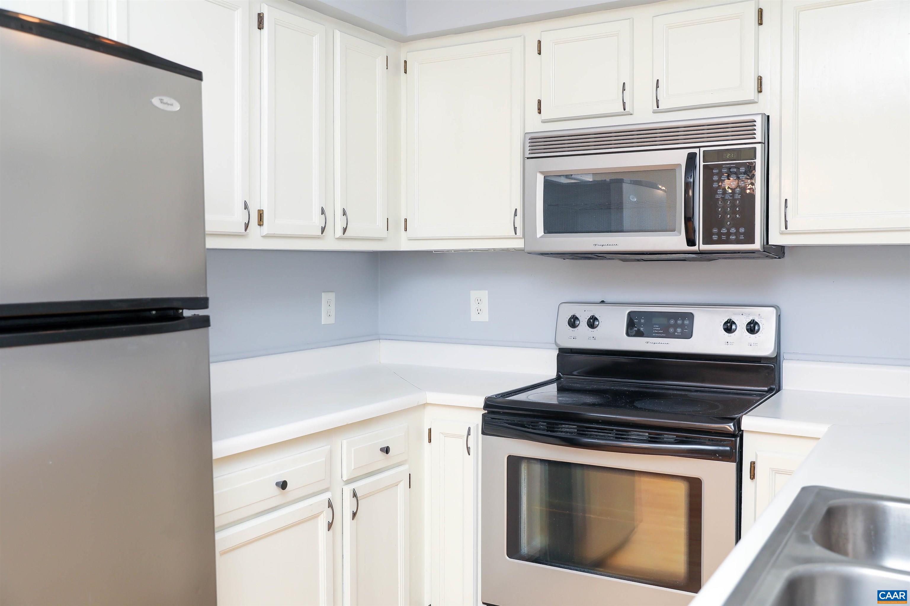Undisclosed Address Charlottesville, VA 22902 - Photo 11 of 49 a kitchen with stainless steel appliances granite countertop white cabinets and a stove top oven