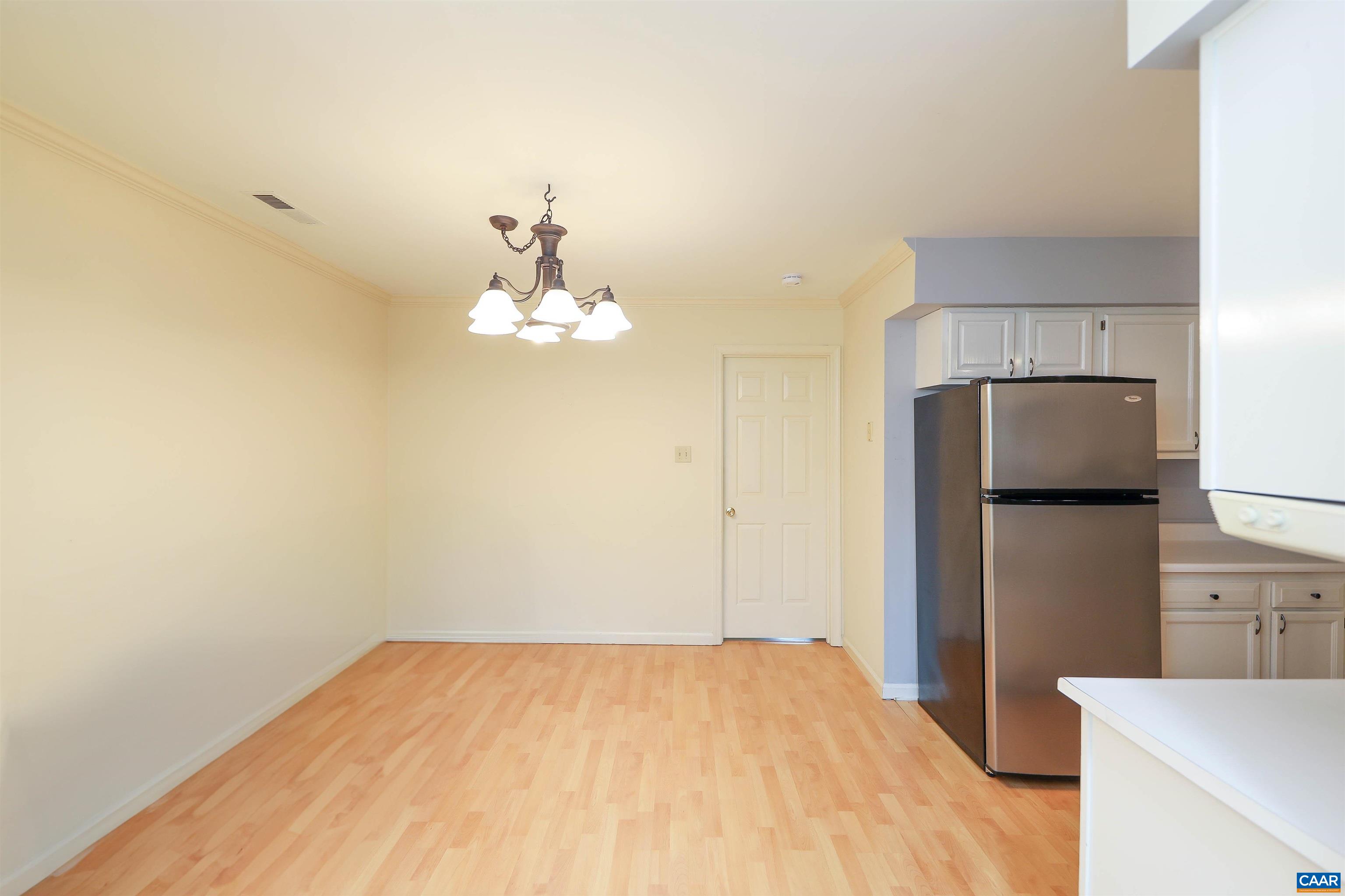 Undisclosed Address Charlottesville, VA 22902 - Photo 13 of 49 a bedroom with a bed and a refrigerator