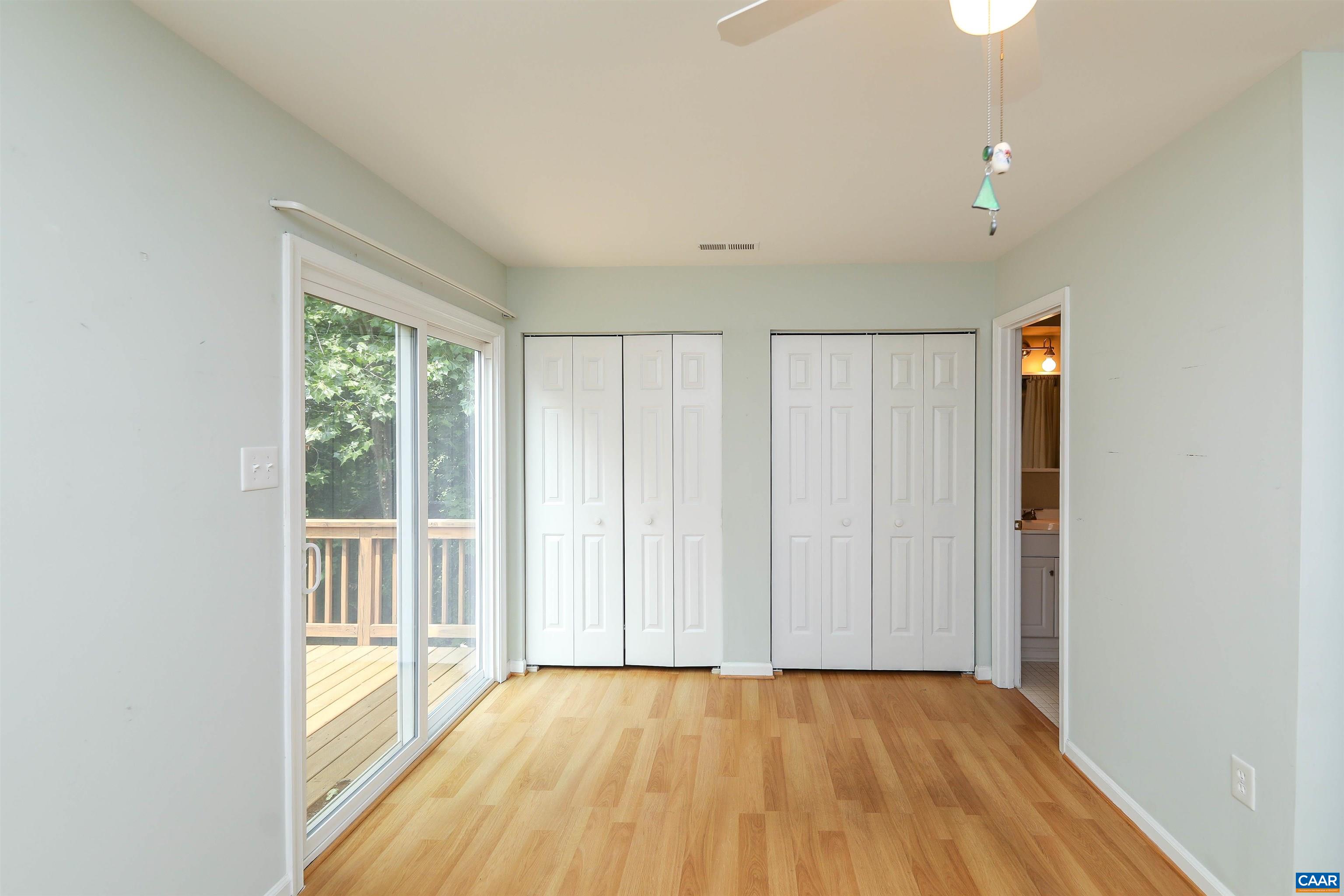 Undisclosed Address Charlottesville, VA 22902 - Photo 14 of 49 a view of an empty room with a window and hardwood floor