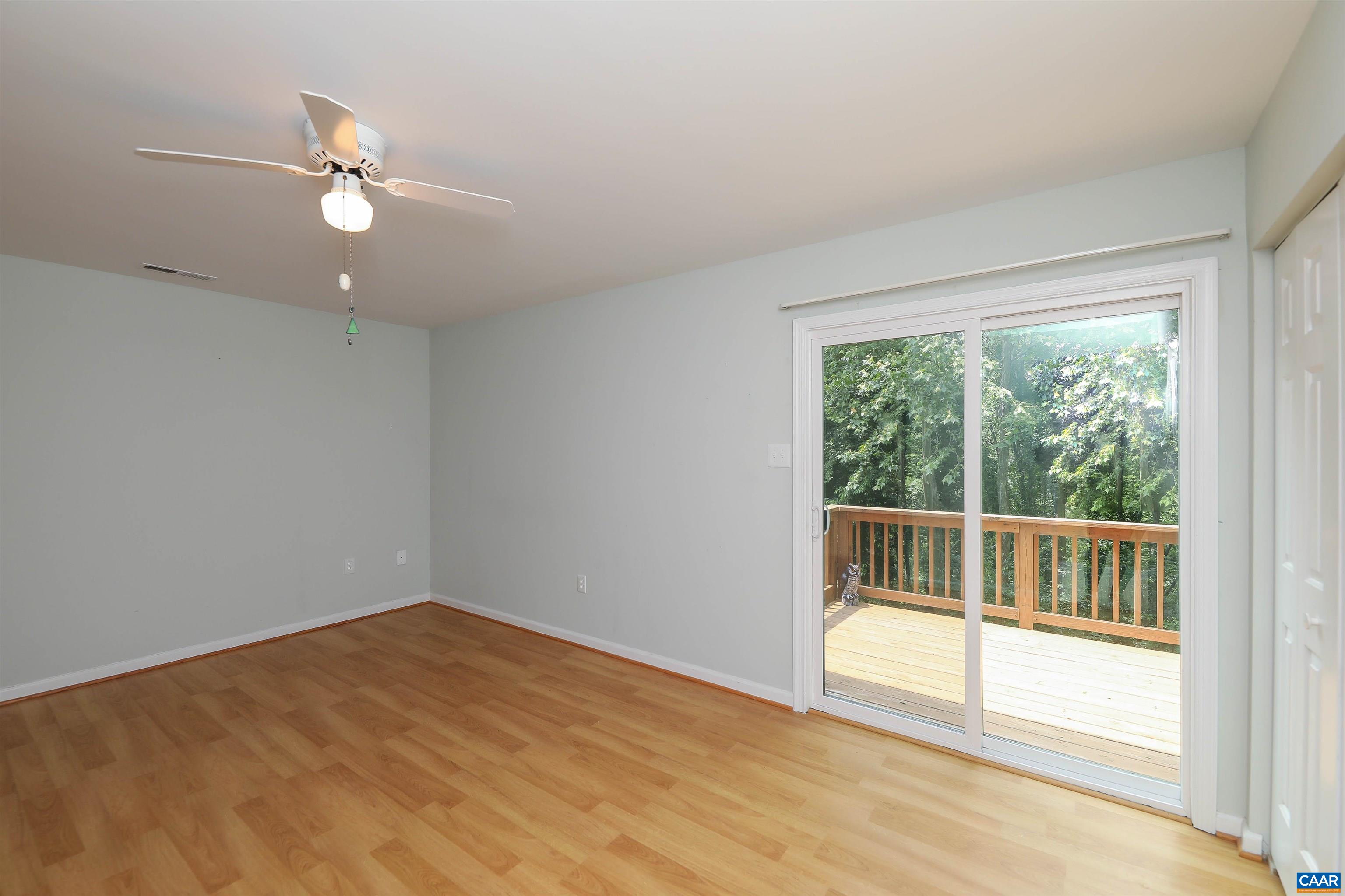 Undisclosed Address Charlottesville, VA 22902 - Photo 15 of 49 a view of empty room with wooden floor and fan