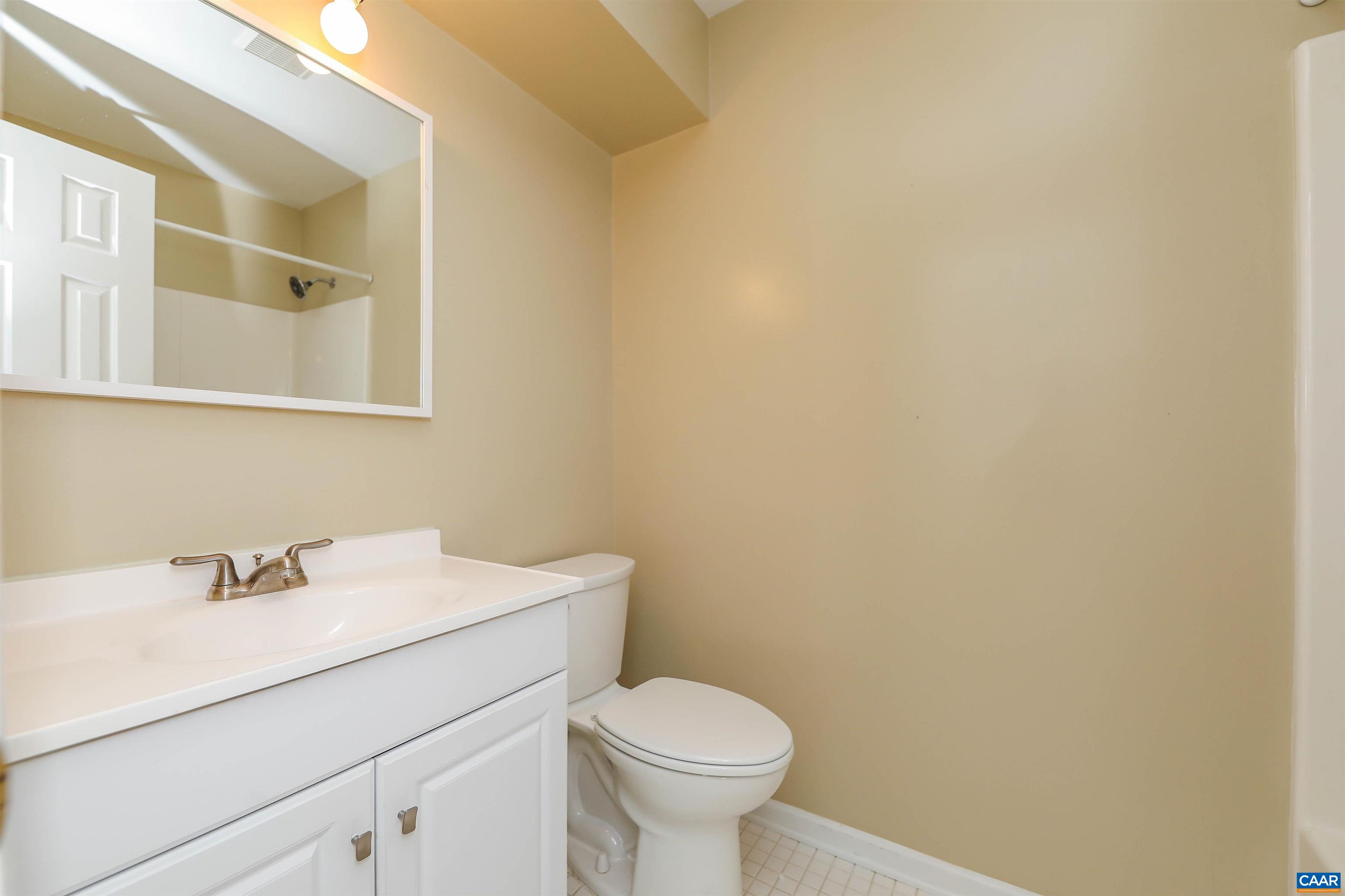 Undisclosed Address Charlottesville, VA 22902 - Photo 18 of 49 a bathroom with a sink mirror and toilet