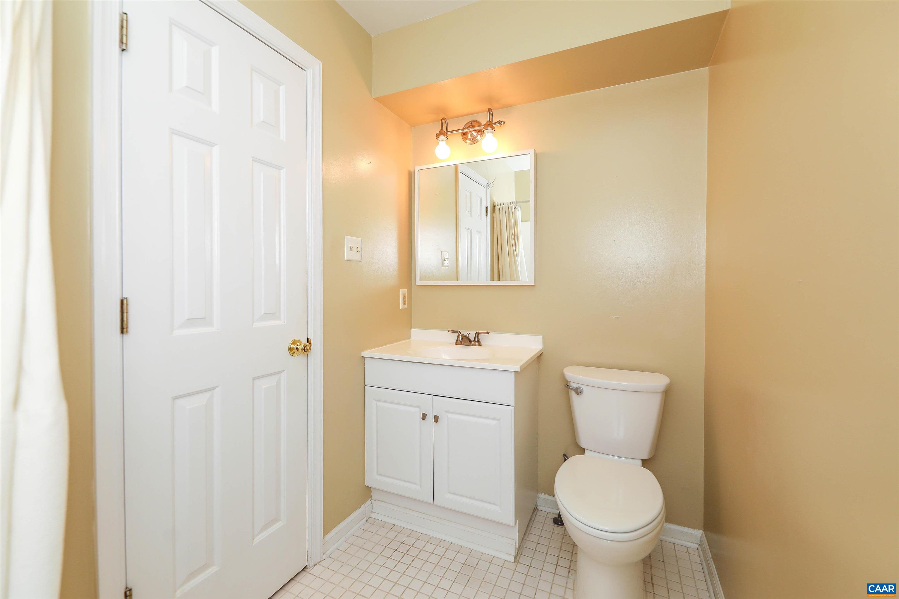 Undisclosed Address Charlottesville, VA 22902 - Photo 19 of 49 a bathroom with a toilet a sink and a mirror