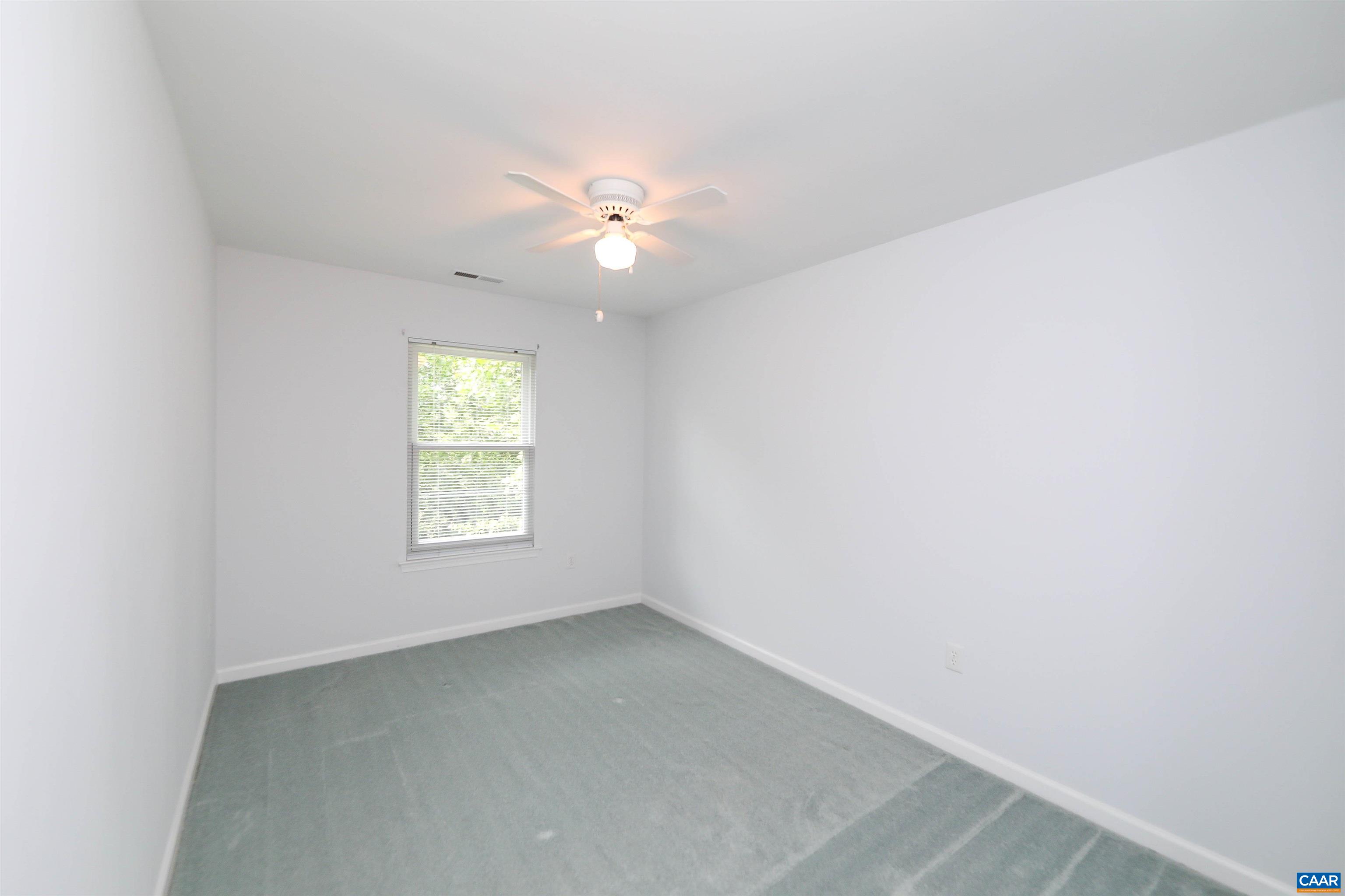 Undisclosed Address Charlottesville, VA 22902 - Photo 21 of 49 an empty room with a window and a fan
