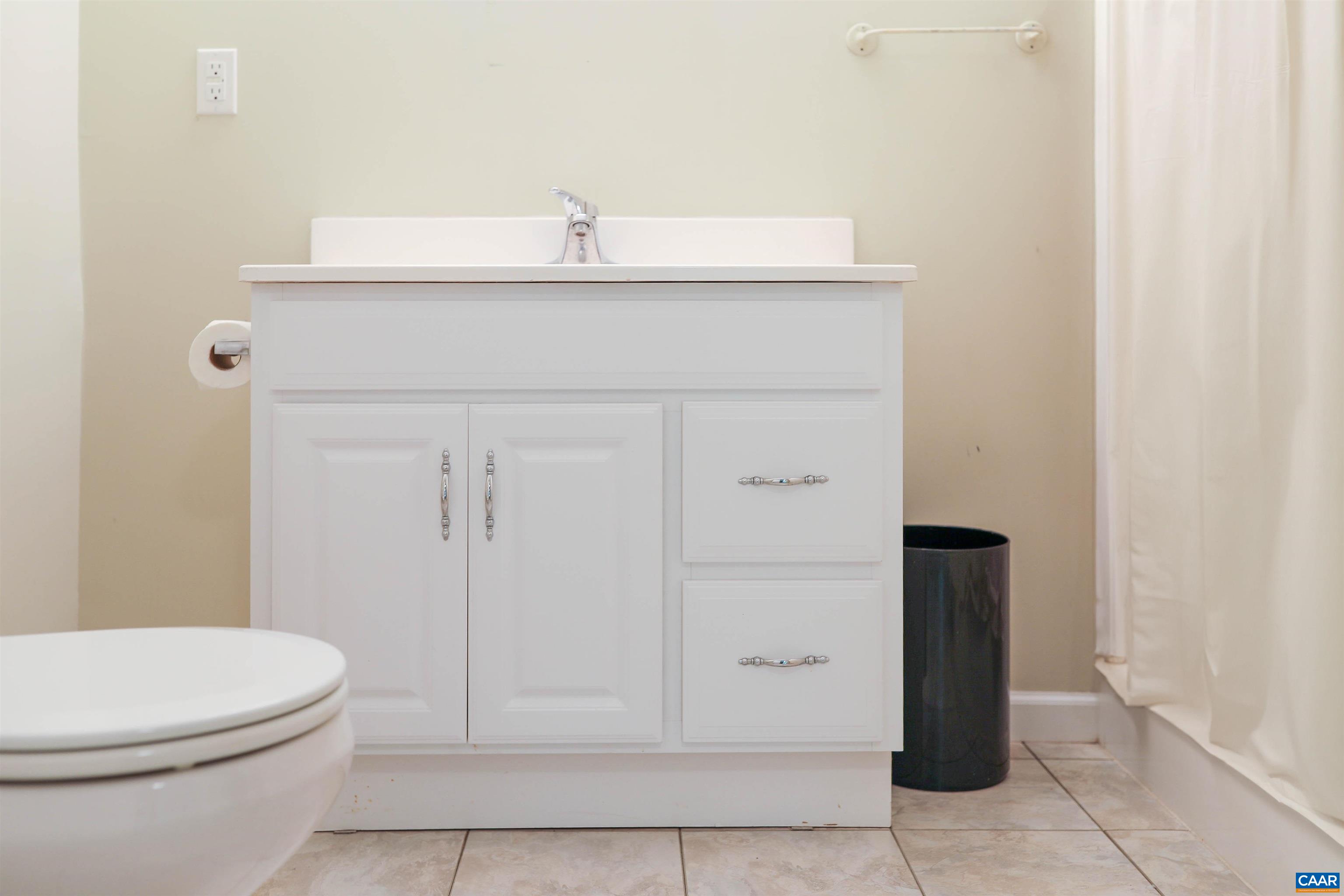 Undisclosed Address Charlottesville, VA 22902 - Photo 35 of 49 a bathroom with a sink a toilet and mirror