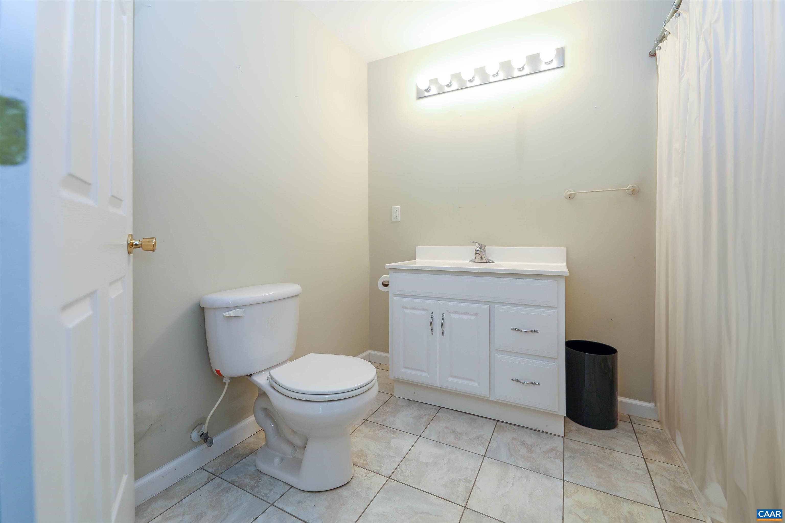 Undisclosed Address Charlottesville, VA 22902 - Photo 36 of 49 a bathroom with a toilet sink and cabinets