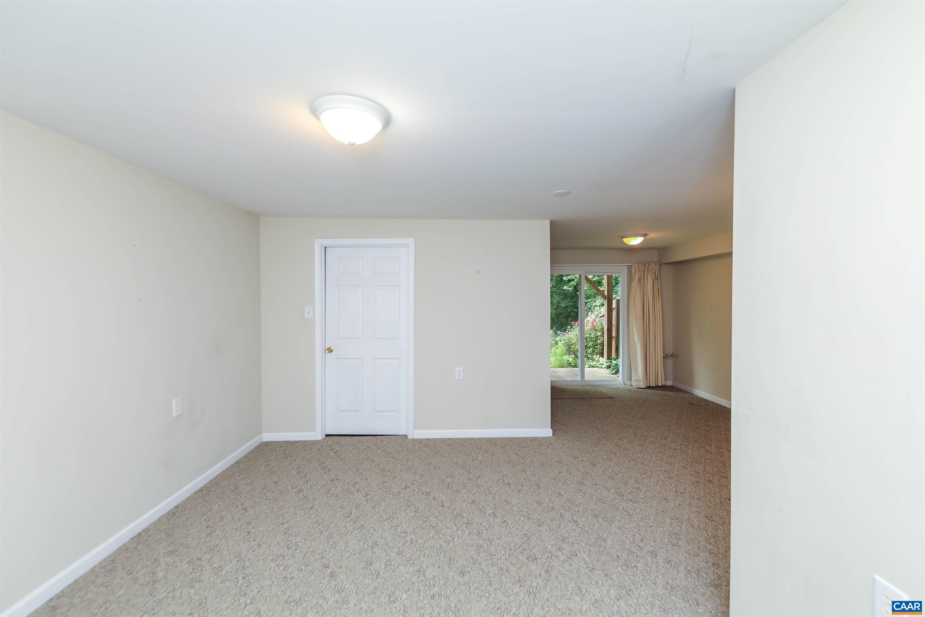 Undisclosed Address Charlottesville, VA 22902 - Photo 39 of 49 a view of an empty room with wooden floor and a window
