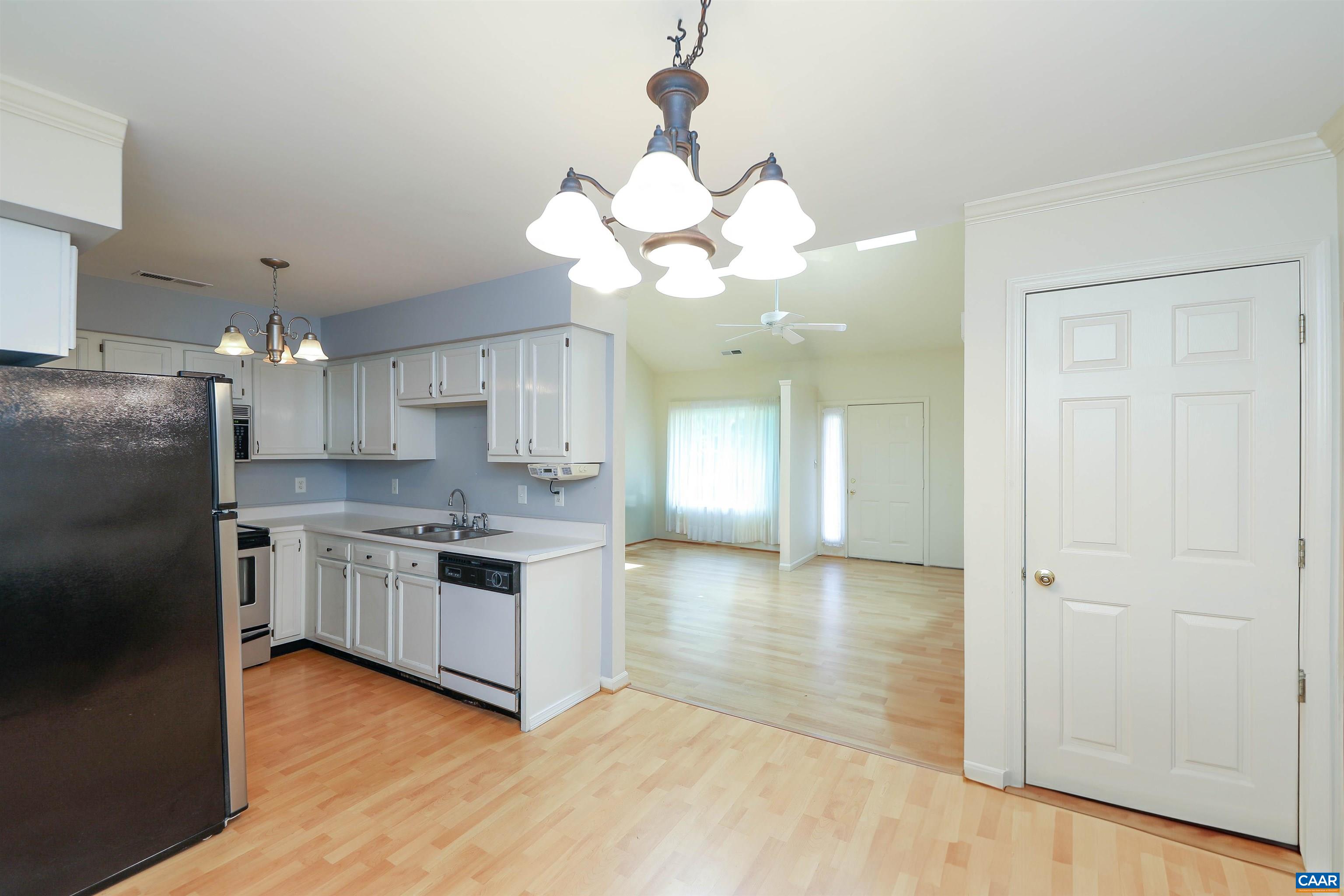 Undisclosed Address Charlottesville, VA 22902 - Photo 10 of 49 a kitchen with kitchen island granite countertop a stove a sink and a refrigerator