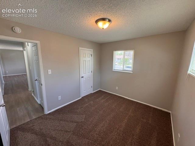 1922 Monterey Road Colorado Springs, CO 80910 - Photo 15 of 21 an empty room with windows and closet