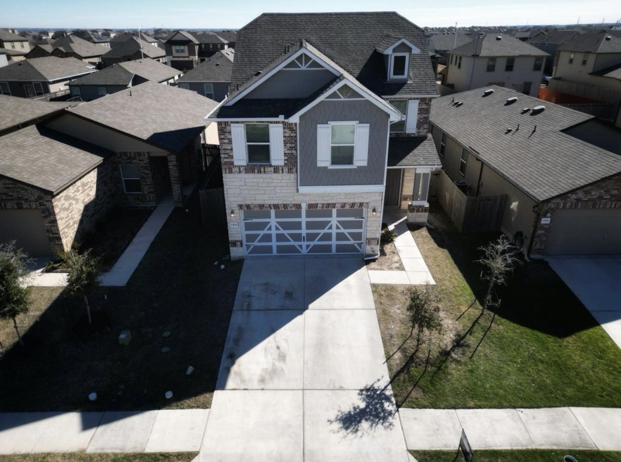 13905 Inaugural Street Manor, TX 78653 - Photo 26 of 26 Aerial perspective of suburban area