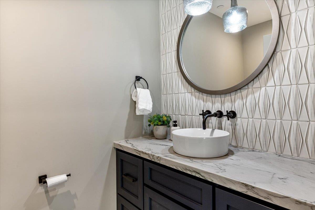 66 Rancho Road Carmel Valley, CA 93924 - Photo 17 of 59 a bathroom with a sink and a mirror