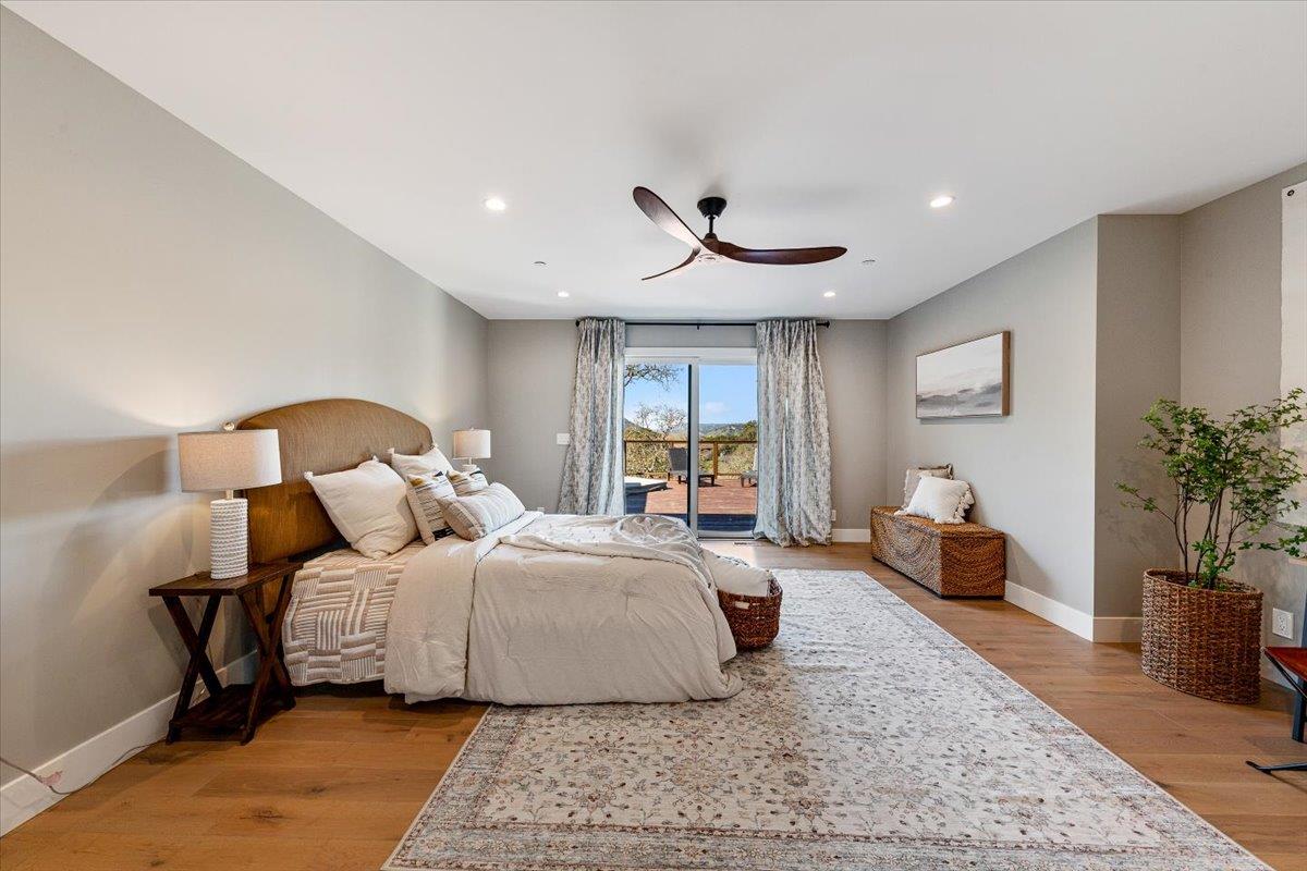 66 Rancho Road Carmel Valley, CA 93924 - Photo 20 of 59 a bedroom with a large bed and a couch