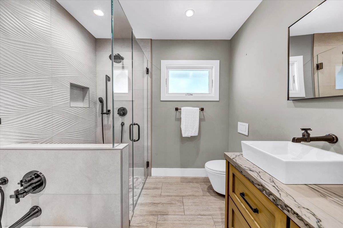 66 Rancho Road Carmel Valley, CA 93924 - Photo 21 of 59 a bathroom with a sink toilet and shower