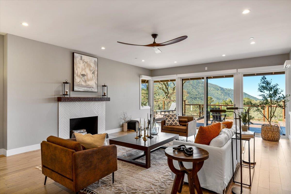 66 Rancho Road Carmel Valley, CA 93924 - Photo 3 of 59 a living room with furniture fireplace and large windows
