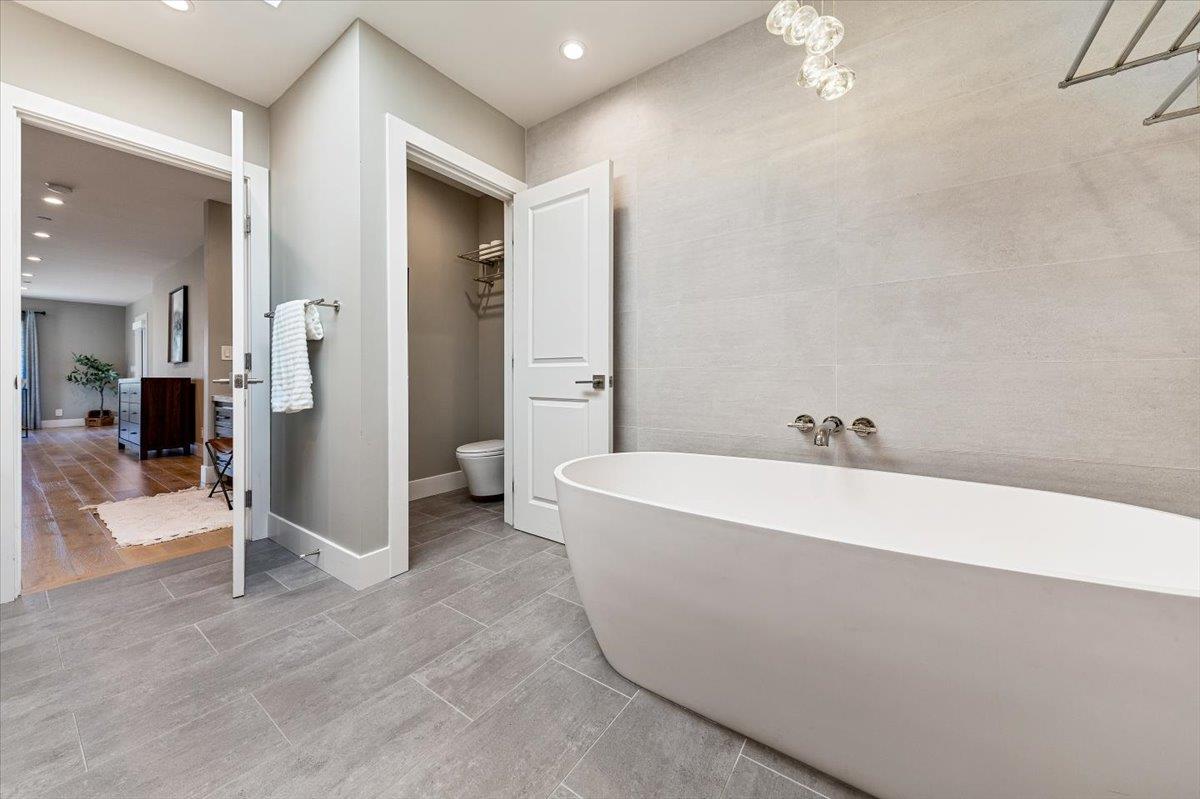 66 Rancho Road Carmel Valley, CA 93924 - Photo 31 of 59 a spacious bathroom with a bathtub and shower