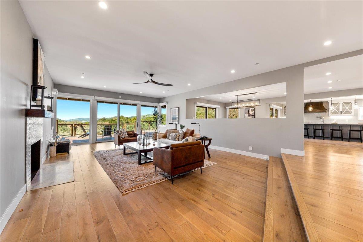 66 Rancho Road Carmel Valley, CA 93924 - Photo 5 of 59 a living room with furniture and a wooden floor