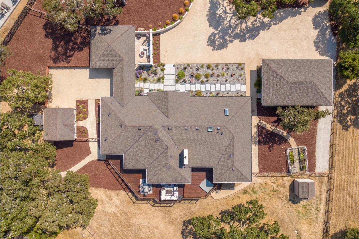 66 Rancho Road Carmel Valley, CA 93924 - Photo 52 of 59 an aerial view of a house with a yard and sitting area