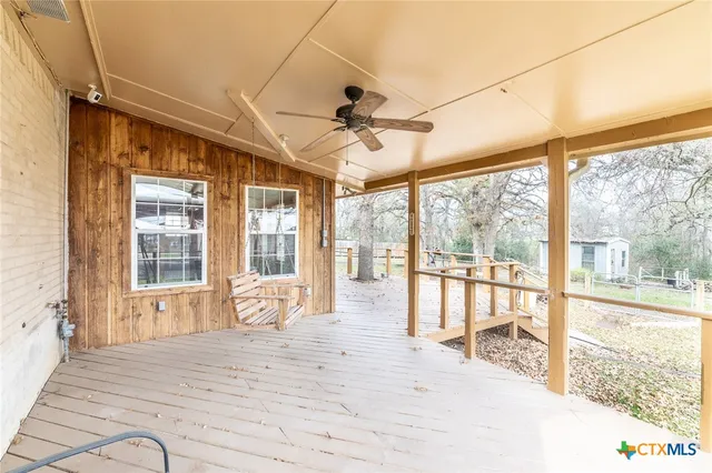 a view of a living room and a large window