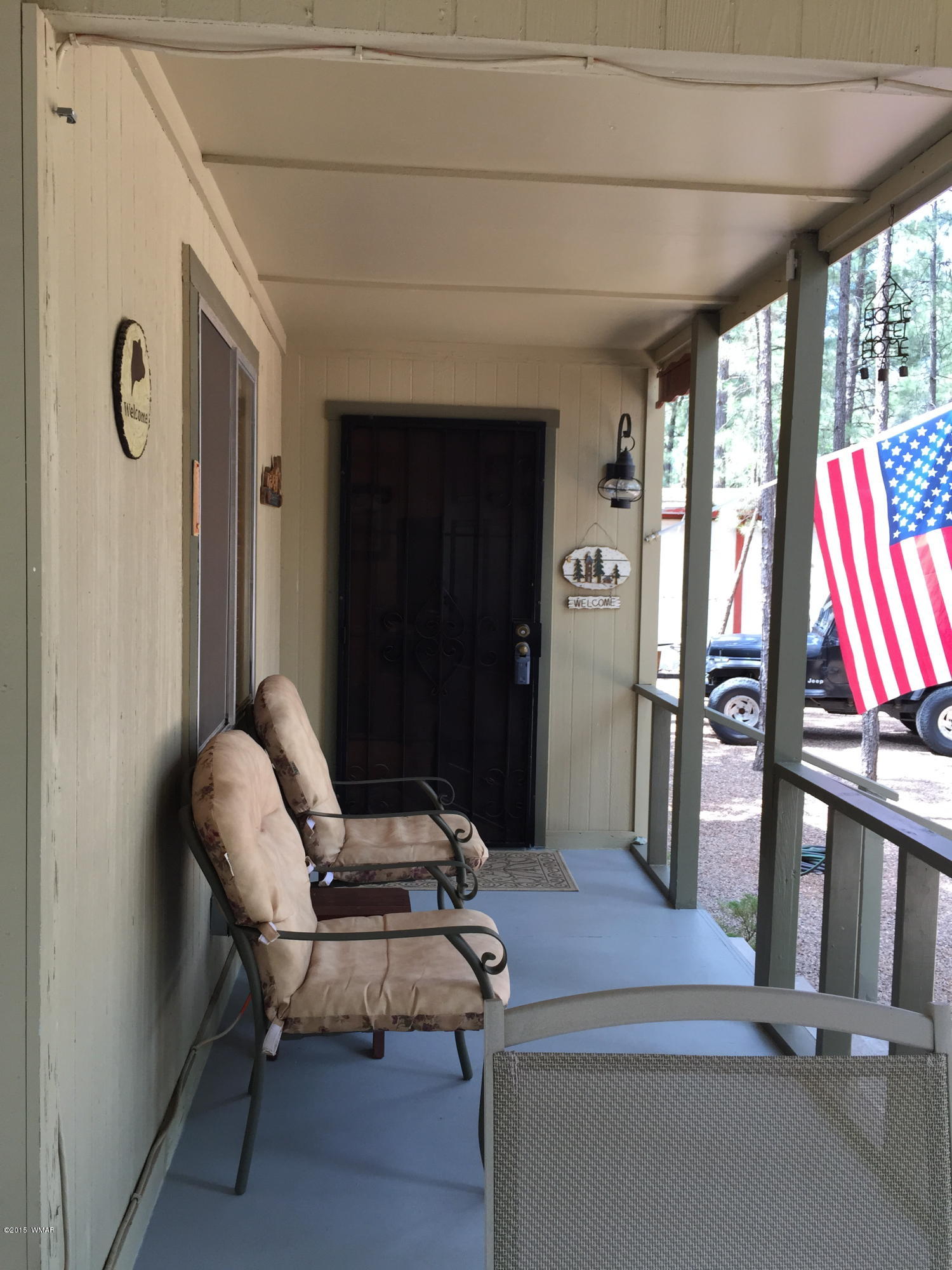 261 Powderhorn Lane Lakeside, AZ 85929 - Photo 13 of 31 a workspace with wooden floor and windows