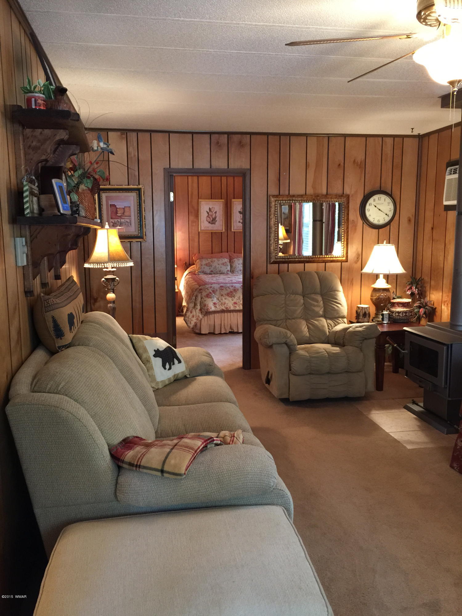 261 Powderhorn Lane Lakeside, AZ 85929 - Photo 16 of 31 a bedroom with bed and a large window