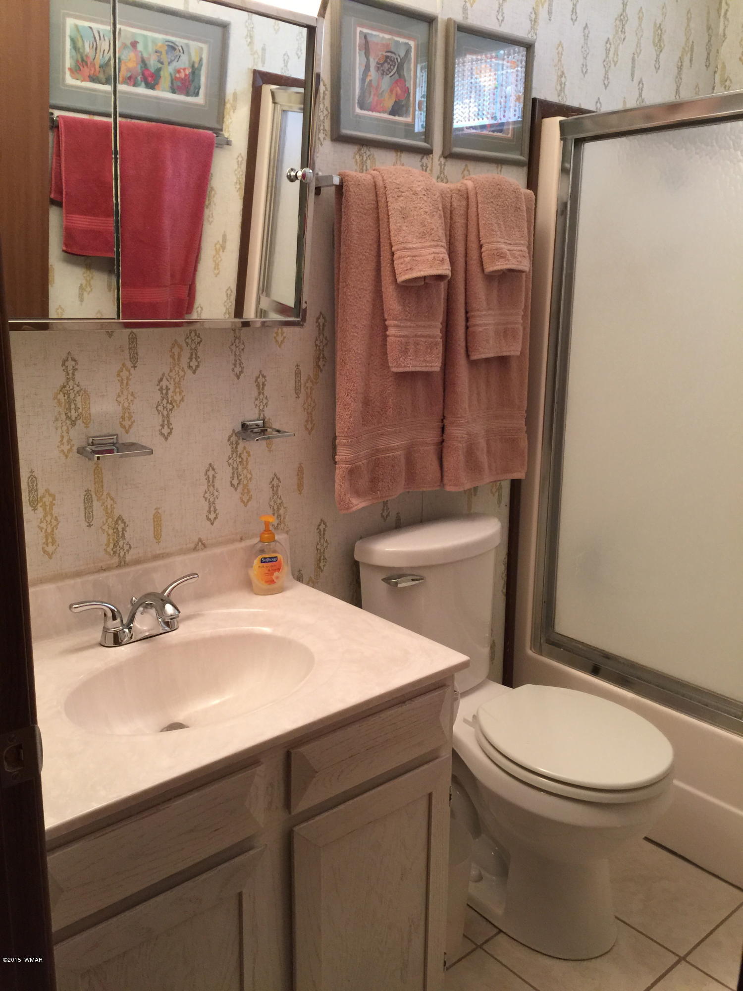 261 Powderhorn Lane Lakeside, AZ 85929 - Photo 23 of 31 a bathroom with a sink toilet and shower