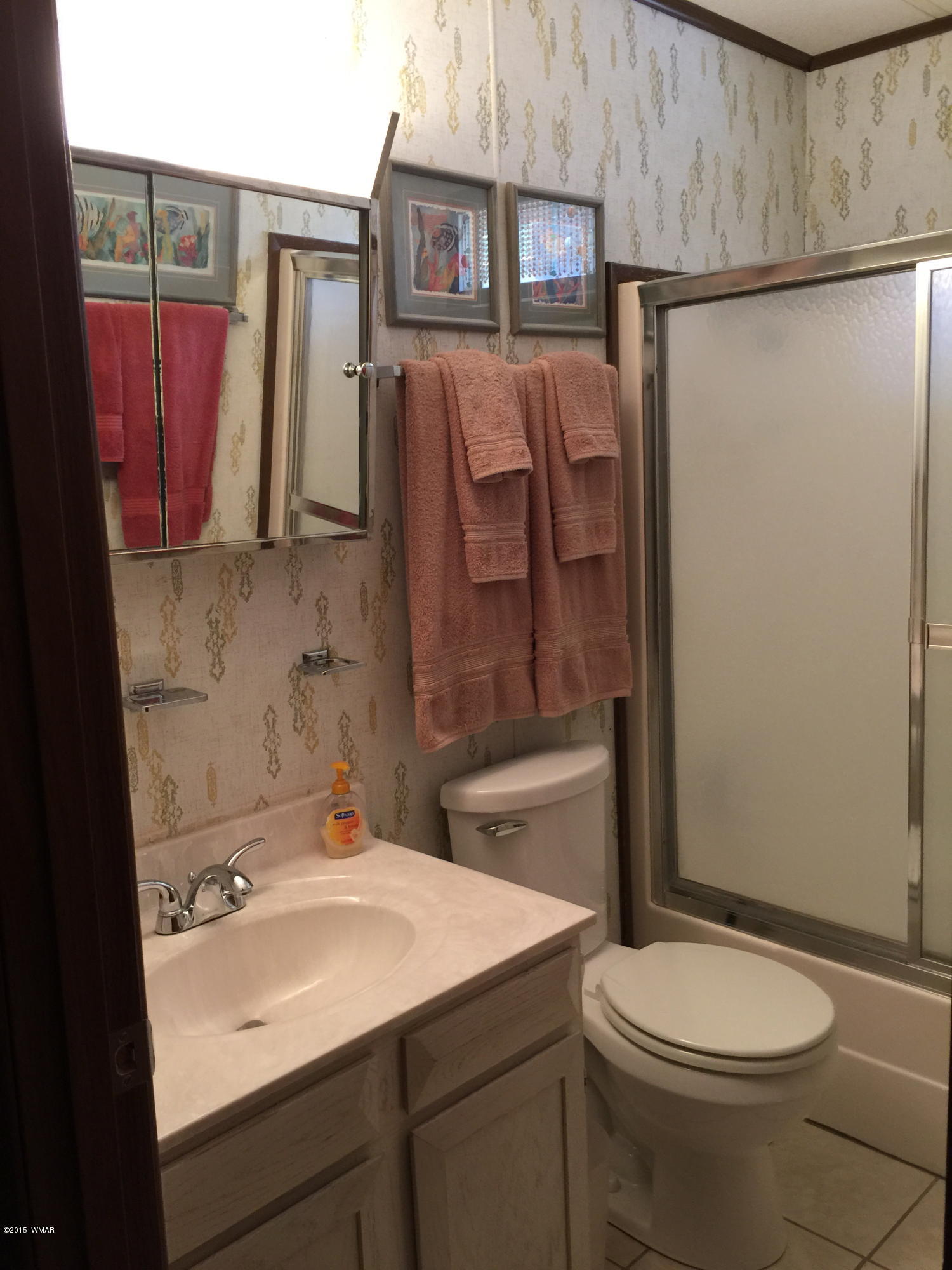 261 Powderhorn Lane Lakeside, AZ 85929 - Photo 24 of 31 a bathroom with a sink toilet and shower