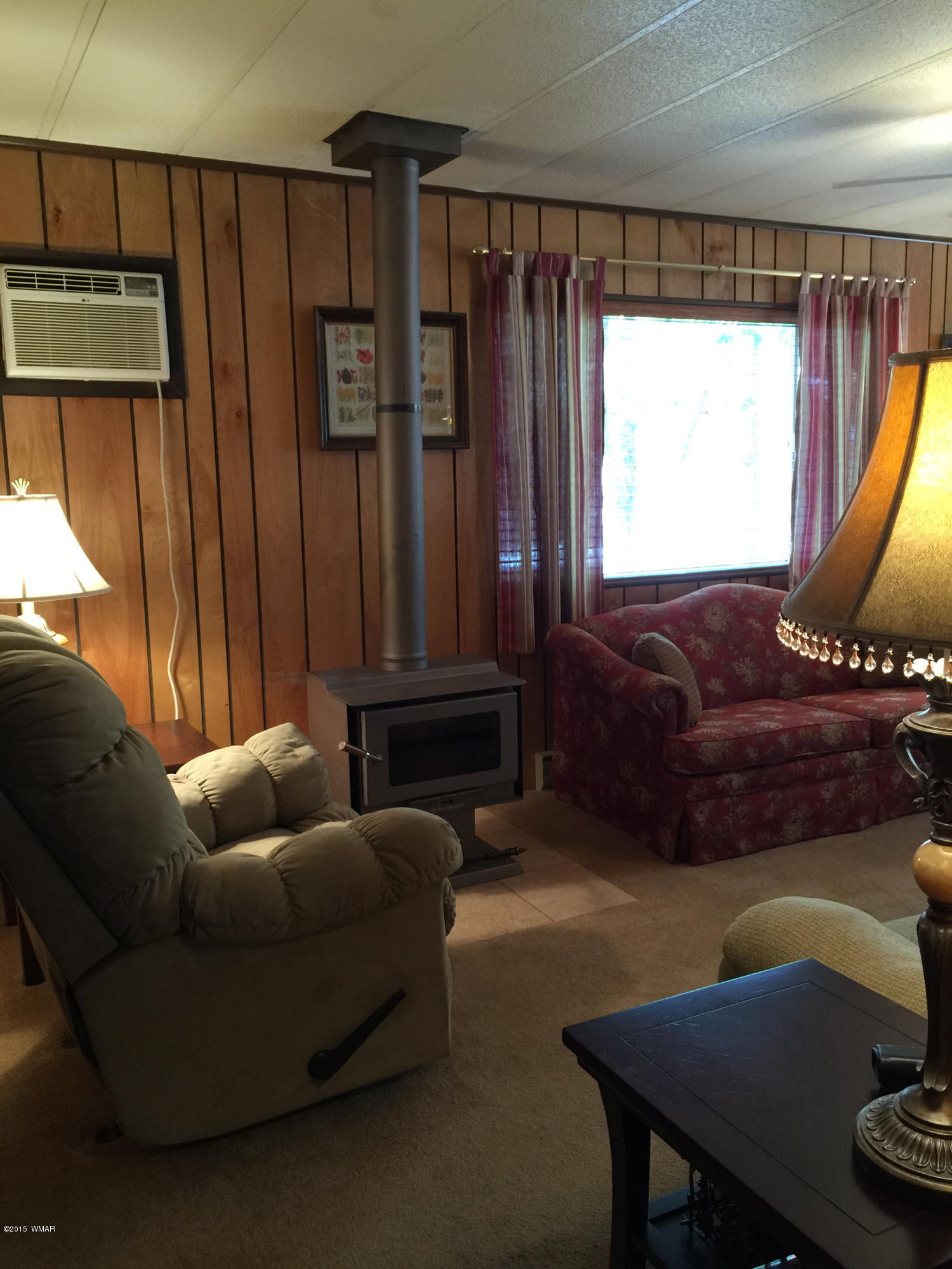 261 Powderhorn Lane Lakeside, AZ 85929 - Photo 27 of 31 a living room with furniture and a window
