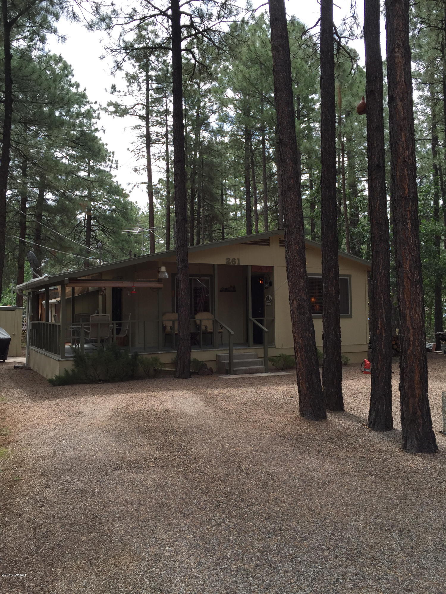 261 Powderhorn Lane Lakeside, AZ 85929 - Photo 3 of 31 a view of a house with backyard and trees