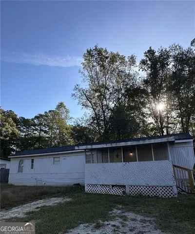 a view of an empty room with windows
