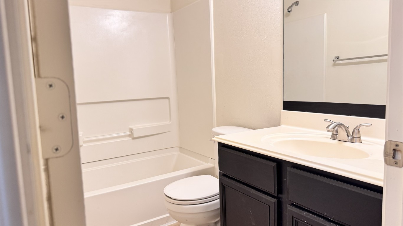 6818 Hampden Point Court Houston, TX 77040 - Photo 17 of 17 a bathroom with a sink a toilet and shower