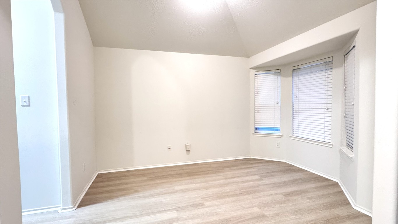 6818 Hampden Point Court Houston, TX 77040 - Photo 3 of 17 a view of a room that has a window in it