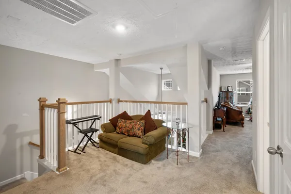 a living room with furniture and a rug
