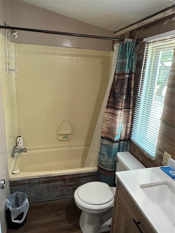 4705 Fox Hollow Road Graham, TX 76450 - Photo 14 of 28 a bathroom with a sink toilet and shower